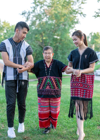 helping grandmother to walk